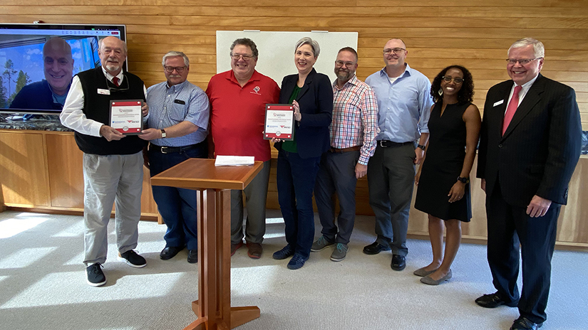 Universities of Wisconsin System President Rothman presents Interfacial with the Universities of Wisconsin Regents Partnership Award.