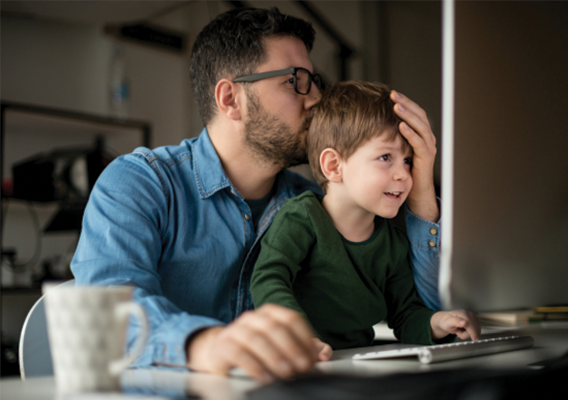 father and child at computer