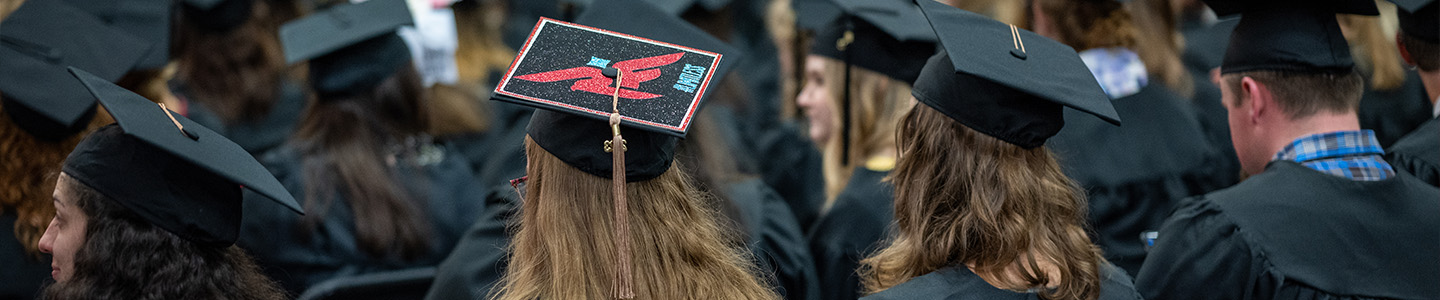 Graduates wearing their graduation caps at commencement