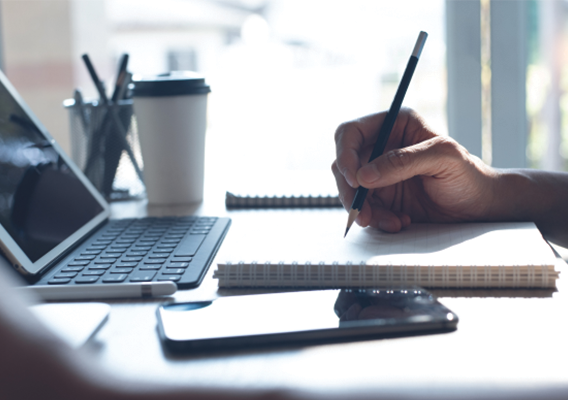 computer and notebook with a person